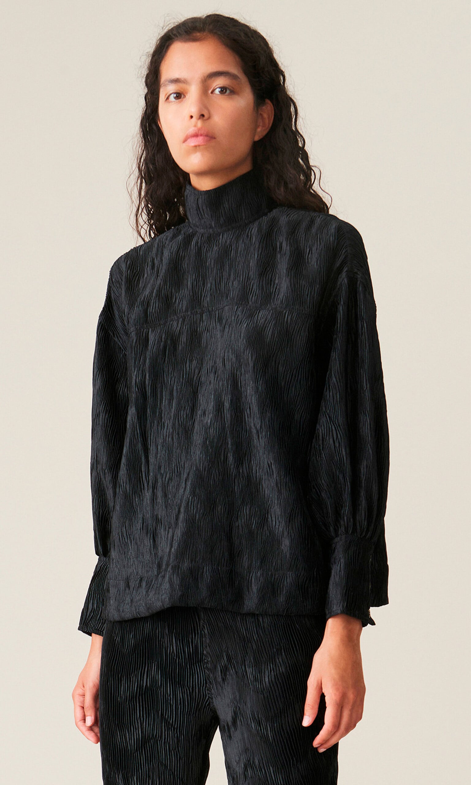 Black pleated top by GANNI