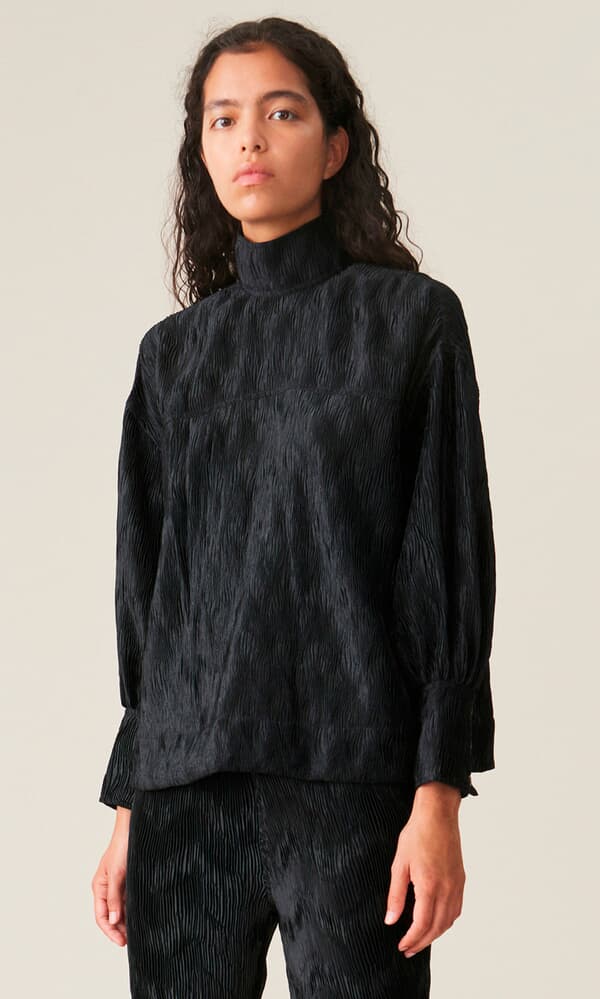Black pleated top by GANNI