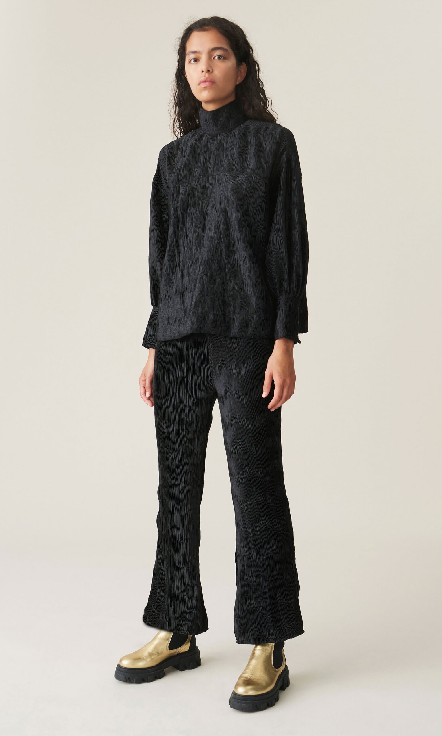Black pleated top by GANNI