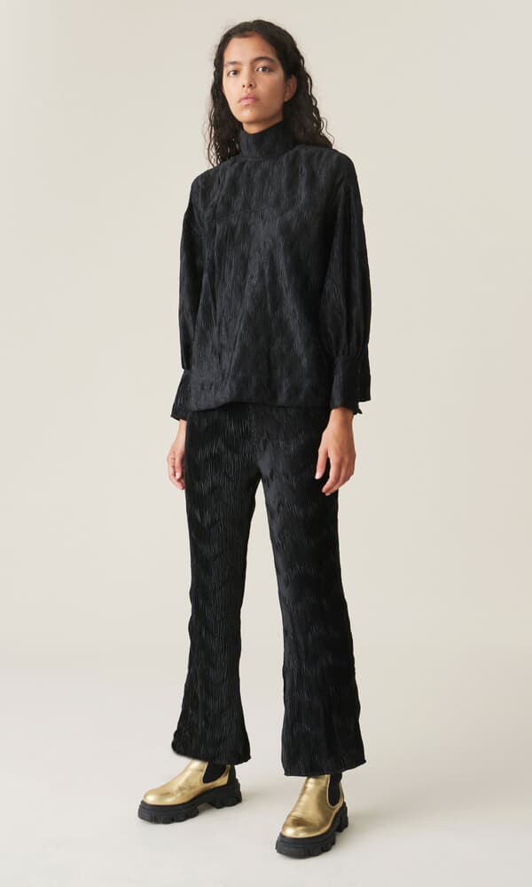 Black pleated top by GANNI