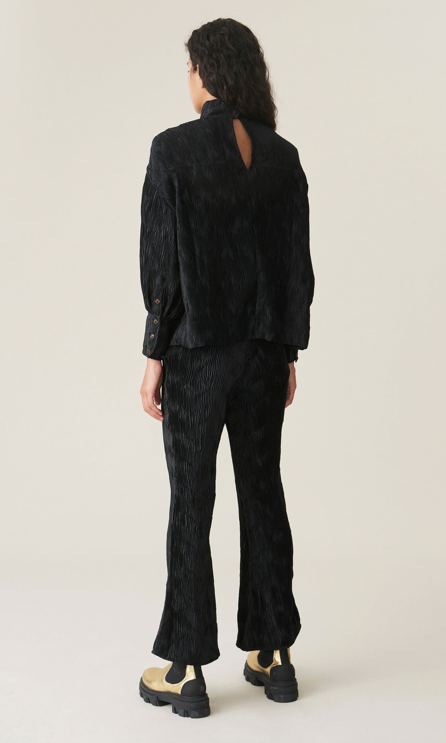 Black pleated top by GANNI